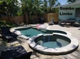 Private pool with jacuzzi  for 2 or 4 - Live like an islander – in your very own tropical duplex. The property is surrounded by beautiful gardens and old Florida Gumbo-Limbo trees. <br />Enjoy your “Private Heated Pool with Jacuzzi”<br />This unit comes with a master bedroom with a King size bed and a second bedroom with two double beds, each with their own private bathroom. The second bedroom with the king bed also has a private entrance. There is fold-out sofa bed in the living room areas and flat-screen TVs with cable channels and Roku. <br />The kitchen has been recently renovated in 2018 with beautiful granite countertops and all new appliances. There is also a separate dining room with a table for 6.<br />Guests can also enjoy complimentary Wi-Fi internet access, front porch and pool in the rear, shared gas grill for all your BBQ needs and free toiletries.<br /><br /> In the evenings, walk down to the beach for epic and romantic sunset views.<br />Note: This unit is located across Gulf Dr, directly opposite Haley’s. Easy street to cross as the speed lim